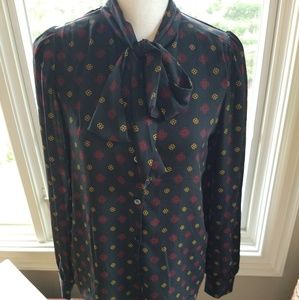 Navy button down shirt with red and yellow flower